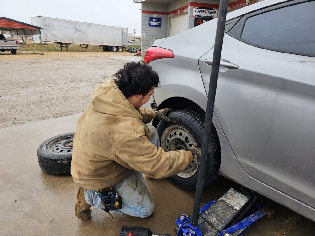 tire shop changing and fixing a flat